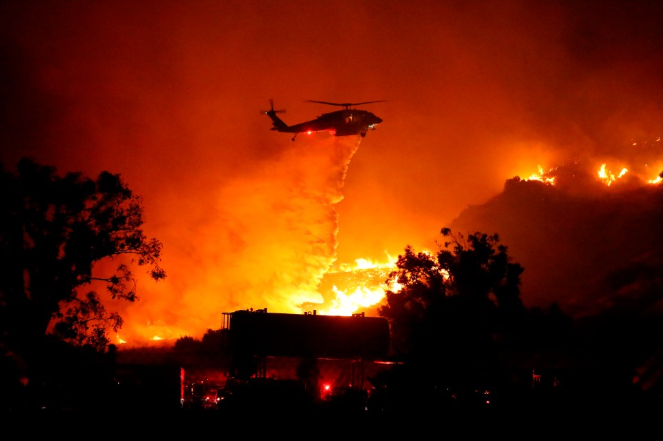 Rescue helicopters were seen attempting to put the fire out