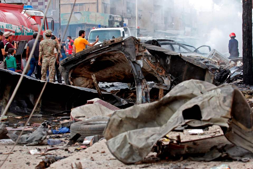  People gather at the site of an explosion in the Kurdish city of Qamishli