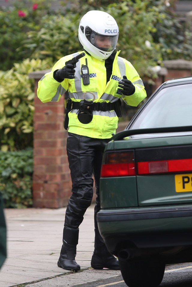  She dons the police outfit to pull Carolyn over