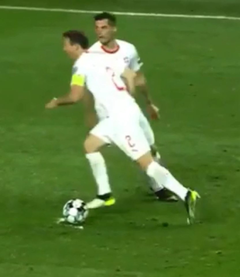 Stephan Lichtsteiner then makes his run and steps over the ball