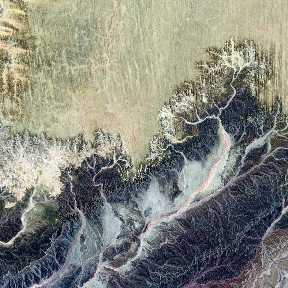  This natural landscape might appear more like a medical illustration of itchy nerve endings. In Western Sahara, Africa, an intense network of wadis drains toward the west, eventually reaching the Atlantic Ocean. These drainage courses are almost always dry in this remote part of the Sahara Desert.