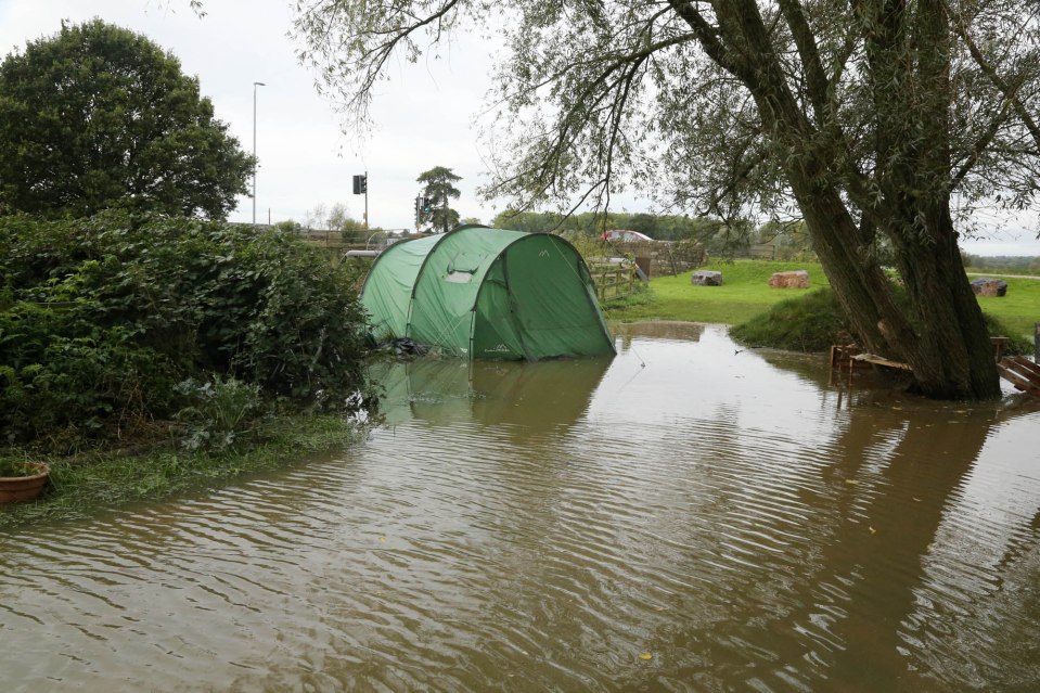  A traveller's site is left flooded after the River Brue burst its banks following torrential rain near Glastonbury, Somerset