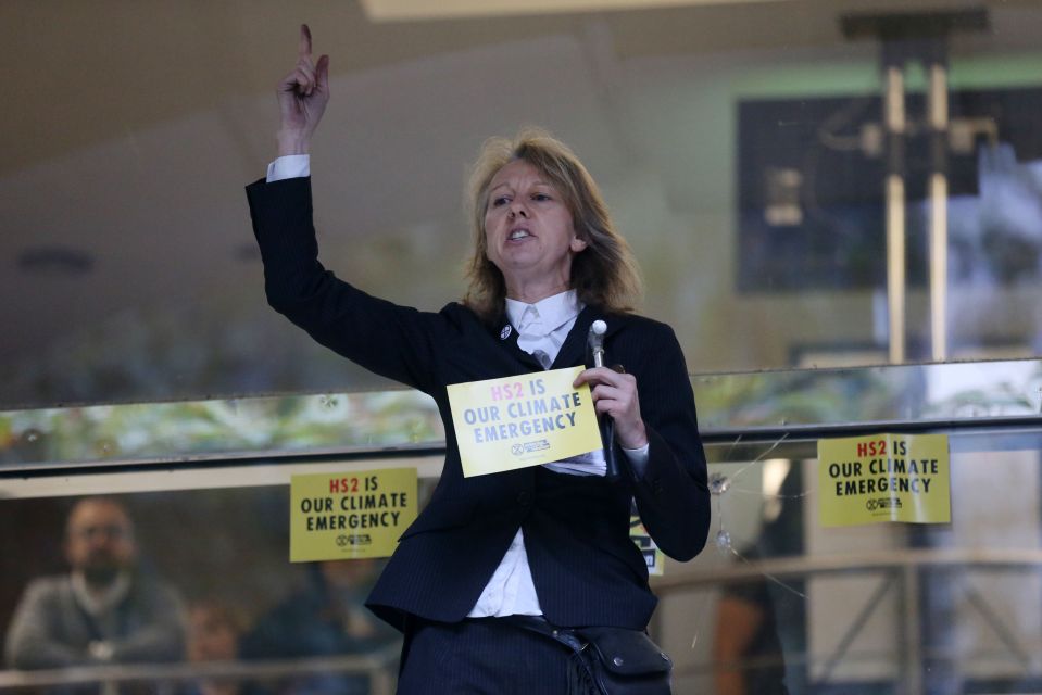  Gail Bradbrook, co-founder of Extinction Rebellion climate action movement, speaks before smashing a window