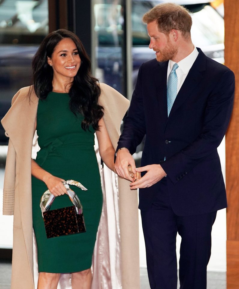  The Duchess kept her camel coat draped over her shoulders