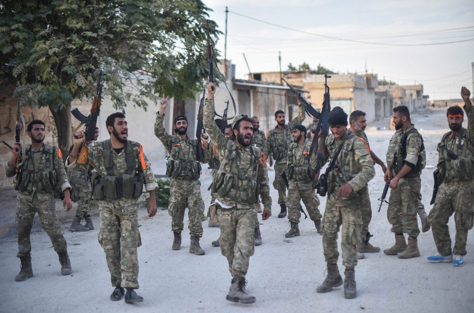  Jubilant Syrian National Army (SNA) members chant as they launch an operation in Syria's Ras al-Ayn villages