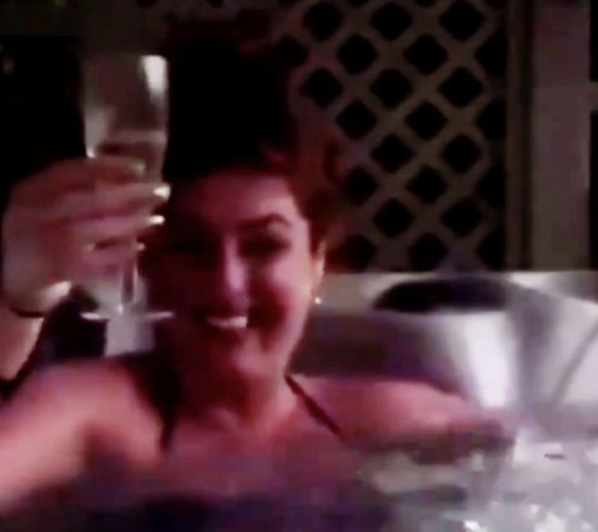  Sharp celebrates her release with a glass of champagne in a hot tub