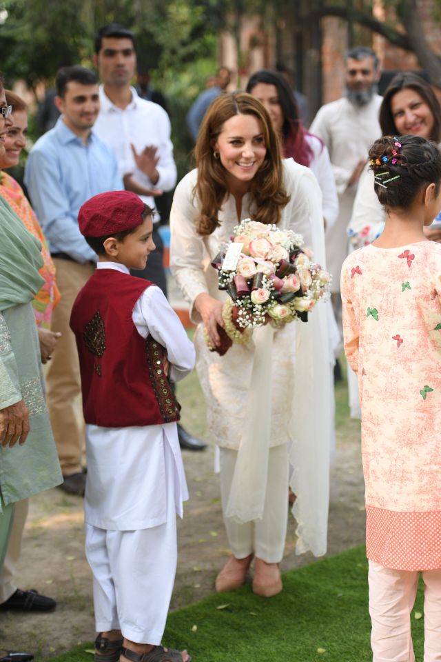  Kate was presented with a bouquet of flowers during her visit to the SOS Children's Village