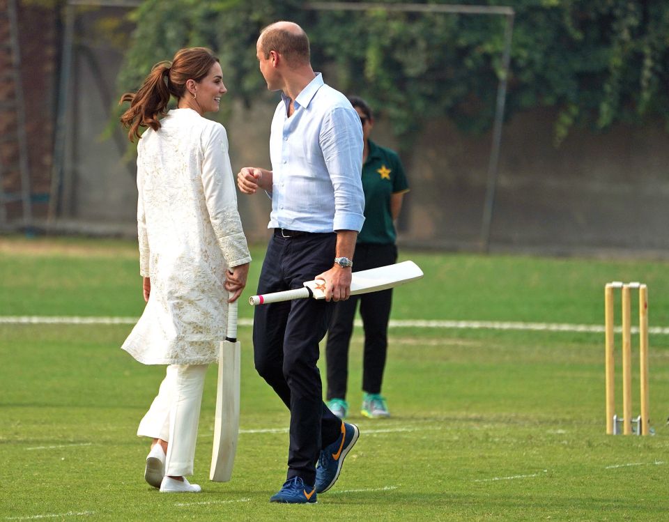  The pair joke on the pitch while visiting the National Cricket Academy in Pakistan