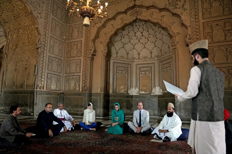 The couple were invited to sit down cross-legged after being introduced to a group of scholars and religious leaders, who were sitting on cushions, for a discussion on promoting interfaith harmony among communities