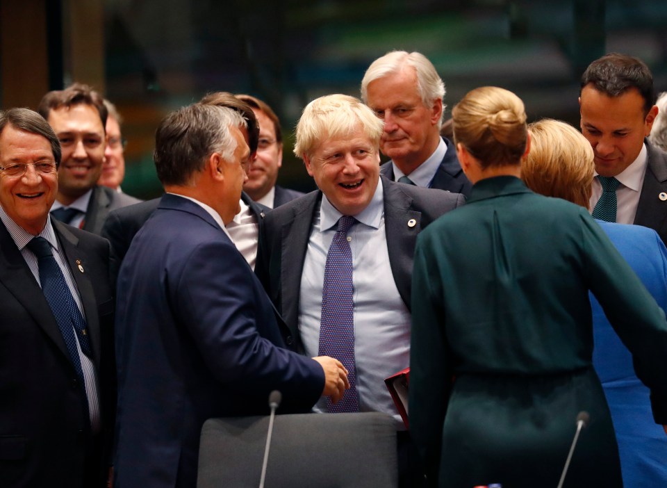  Boris Johnson shares a laugh with other EU leaders after sealing his deal