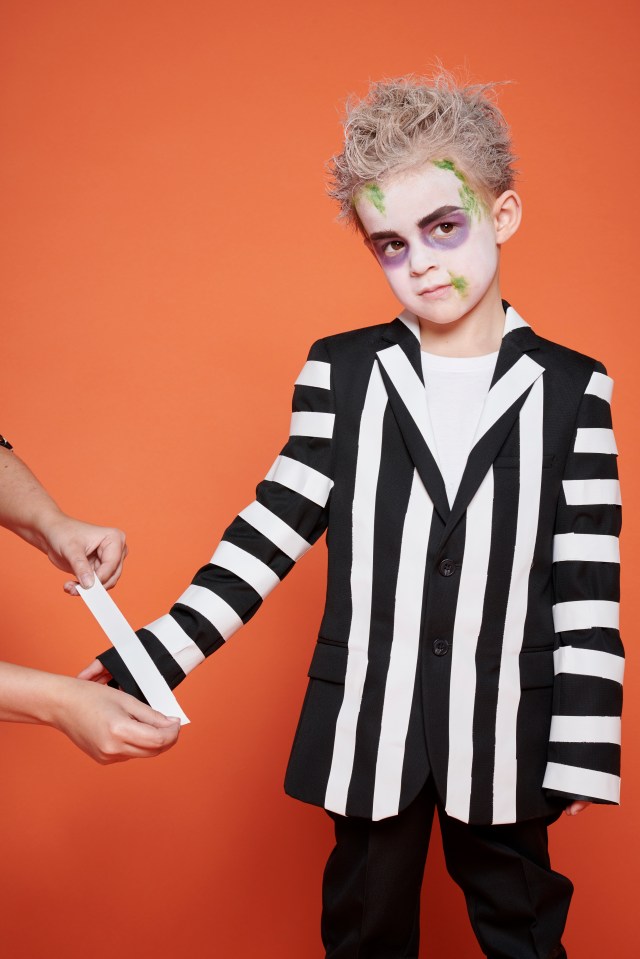  Transform an ordinary black suit jacket into a Halloween look with white tape