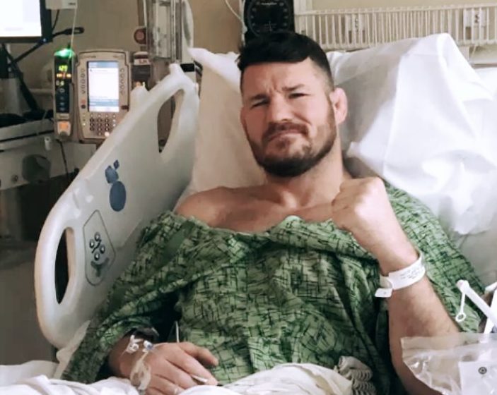  All smiles as Michael Bisping sits up in the hospital bed after surgery