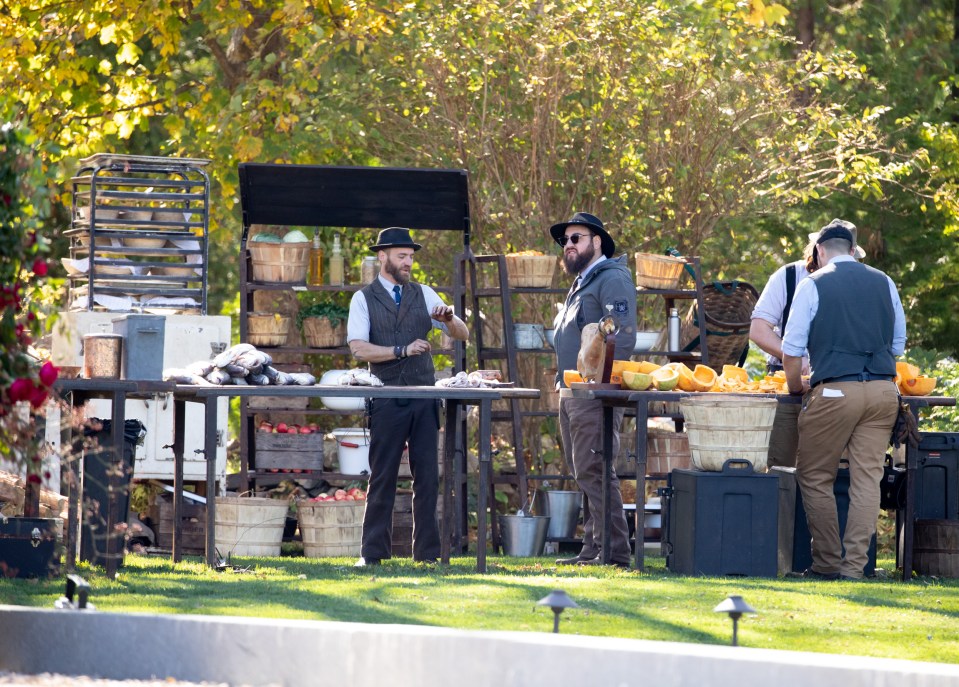  Hipster chefs were seen preparing mountains of food in the gardens of the mansion