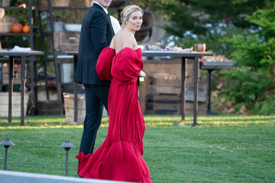  Sienna Miller looked ready to celebrate as she arrived wearing a stunning a red maxi dress