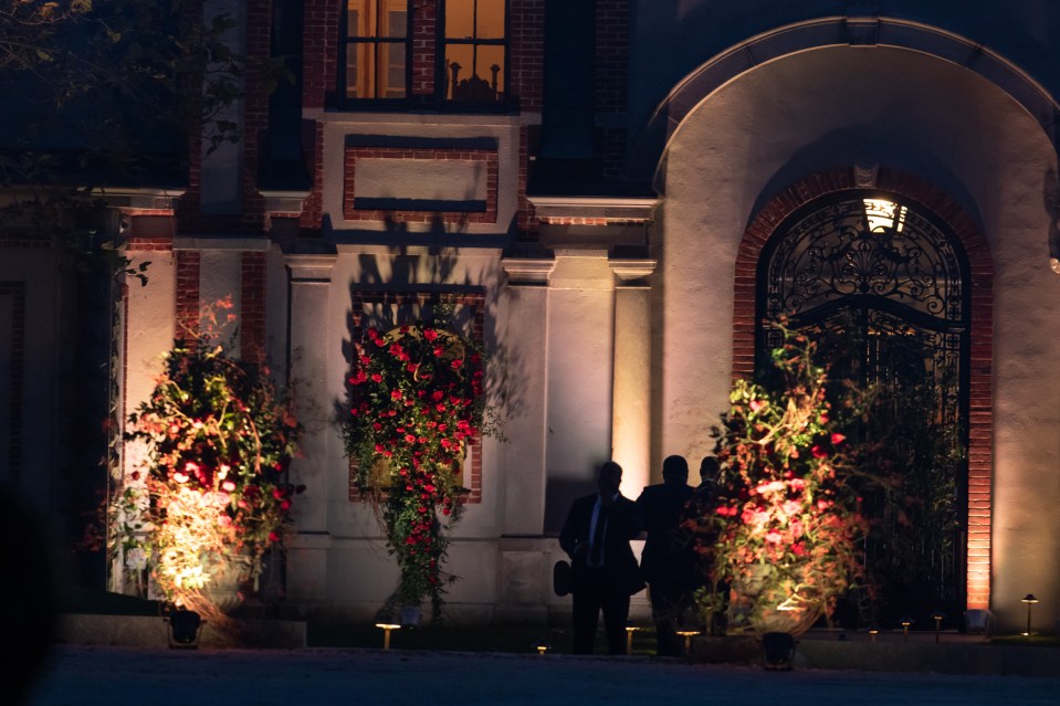  Security guards stand outside the wedding venue as celeb guests partied into the small hours