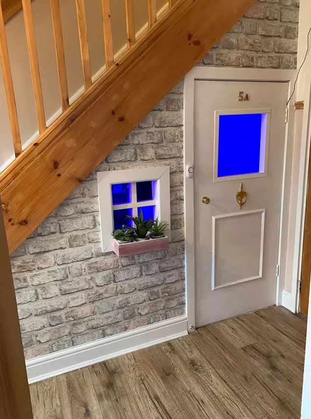  The space under the stairs was transformed to look like a mini home for under £100