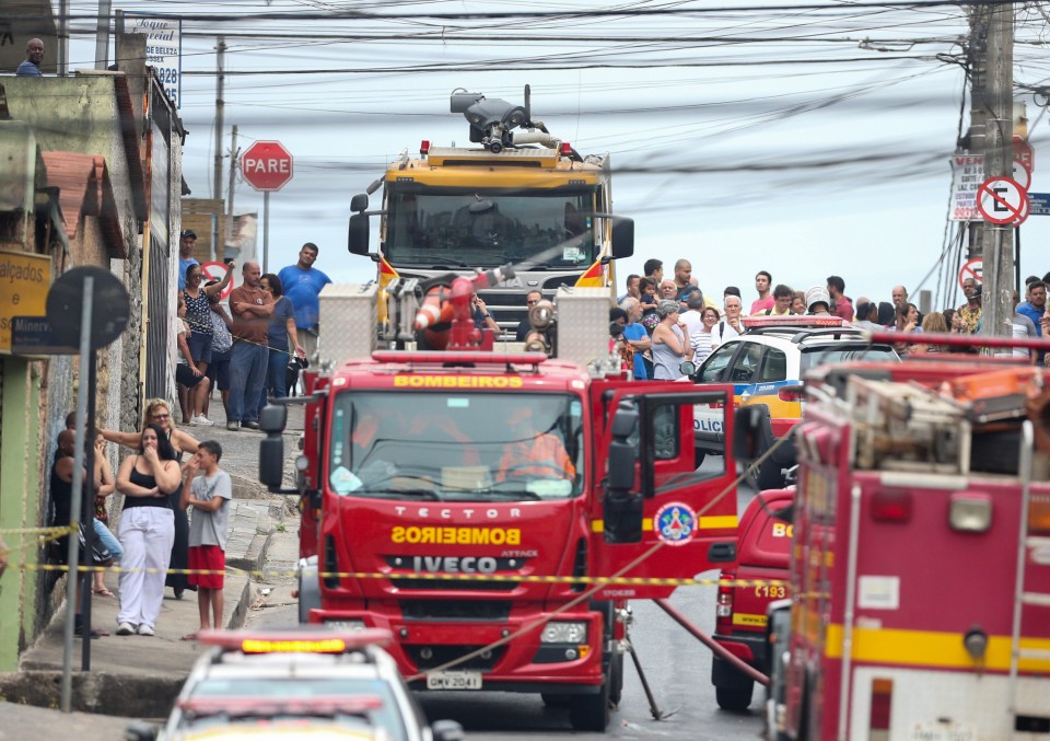  Fire trucks at the scene today, as residents watch on