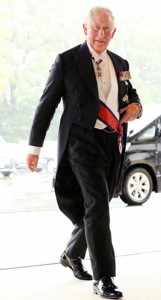 Prince Charles arrives at the elaborate event in Tokyo, Japan