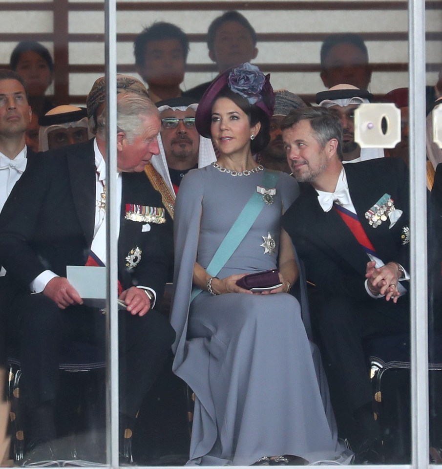 Prince Charles, left, chats with Crown Princess Mary and Crown Prince Frederick of Denmark