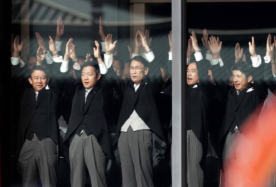 Japanese officials shout banzai cheers for Emperor Naruhito