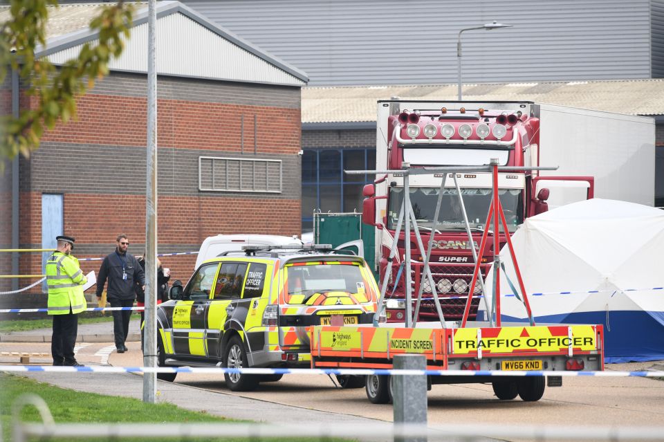  Police are pictured in Grays, Essex, after 39 suspected migrants were found dead inside a chiller lorry today