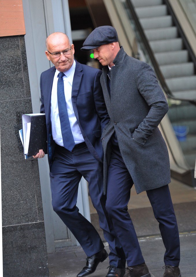  The former hard tackling midfielder (right) has denied a charge of assaulting his wife