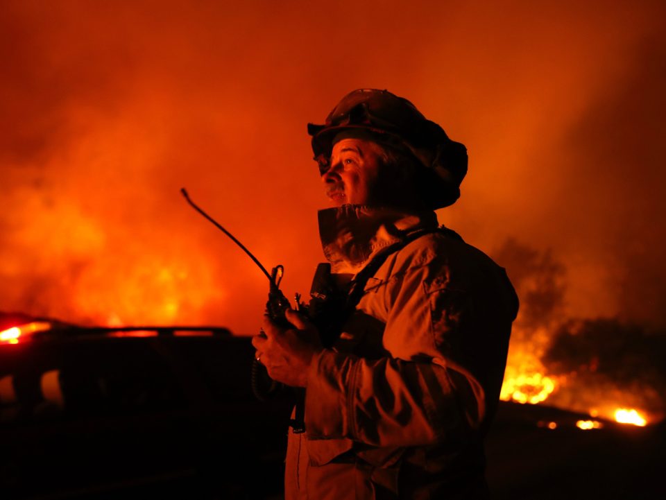  A firefighter monitors the Kincade Fire as it raged through the wine country overnight