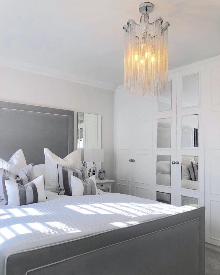  Mrs Hinch's bedroom features perfectly 'chopped' cushions and a chandelier