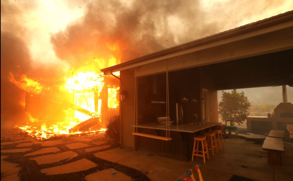  Part of a family home is still burning after the sun rose over the northern California town of Geyserville