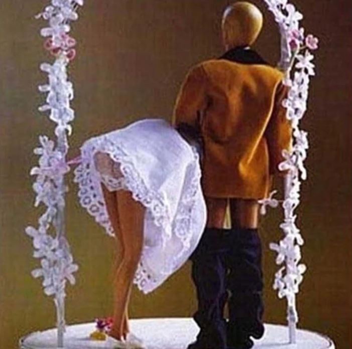  The couple went for a rather naughty cake topper