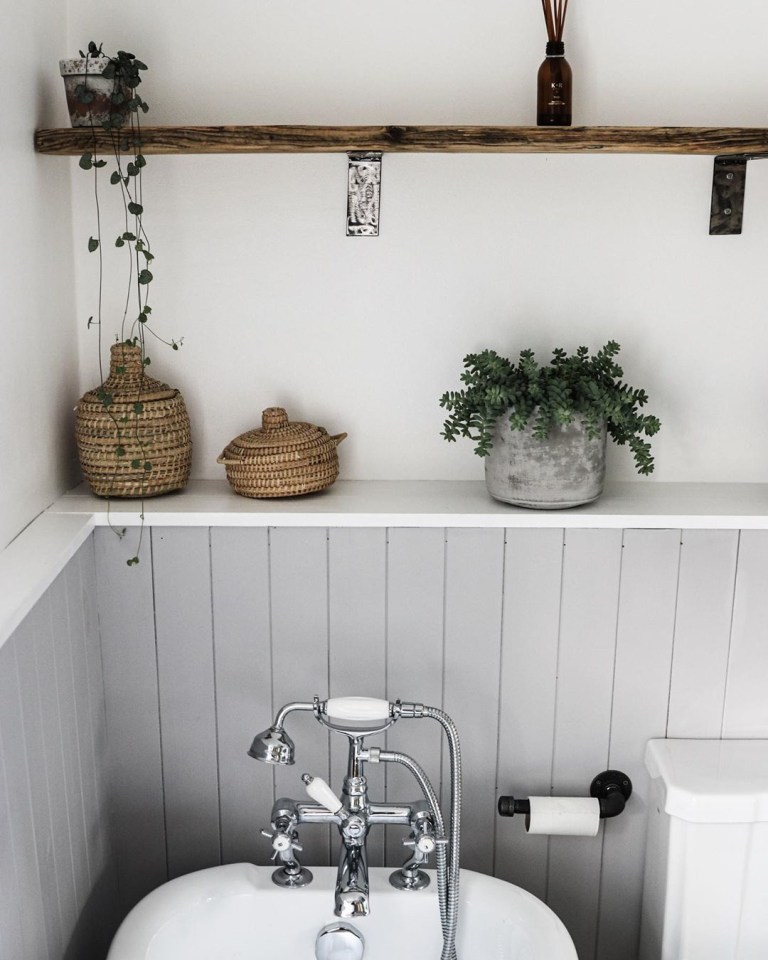  A shelf in the bathroom is made from re-claimed wood, while other decorations were sourced on Gumtree, eBay and Facebook Marketplace