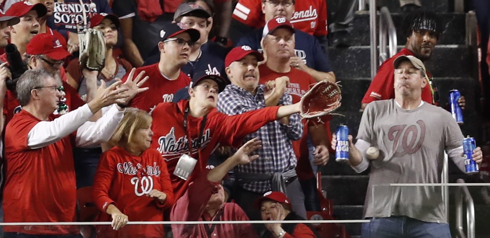  A baseball fan took a home run to the gut to save his two beers during the World Series game on Sunday