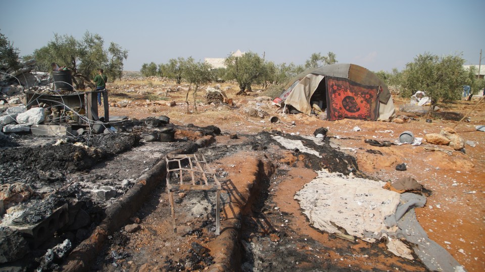 Scorched earth and household items were all that remained after the raid