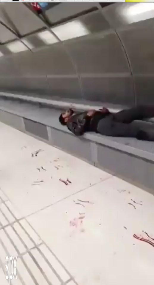  One casualty is seen lying semi-conscious in a pool of blood at La Sagrera tube