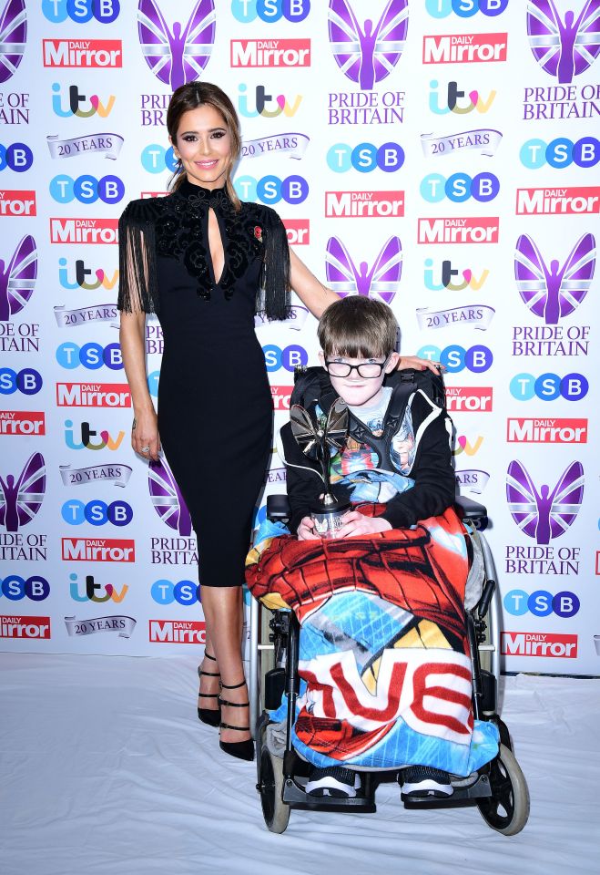  Cheryl shares the carpet with a Pride of Britain Award winner Aaron Hunter