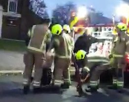  Fire crew gathered around the soldier after the attack