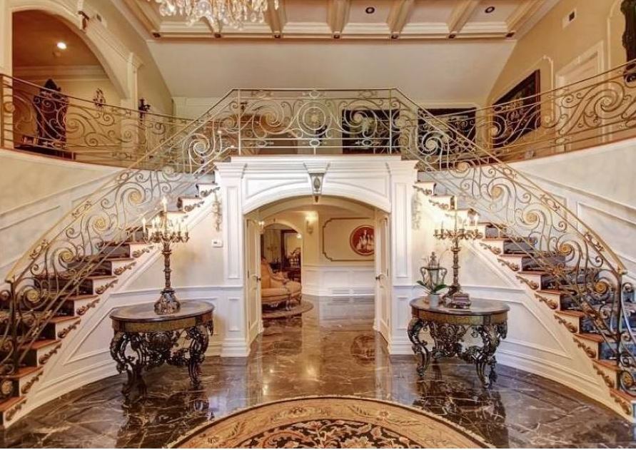  The Chateau-style mega-mansion boasts a grand stairway