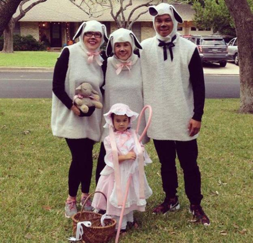  This little girl leads her flock of sheep