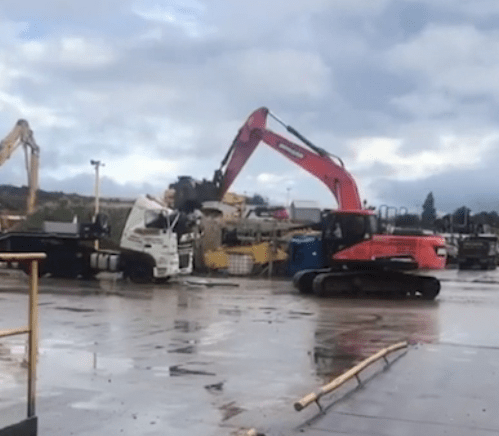  Footage appears to show the man using a digger to damage a lorry cab at the yard in Bradford