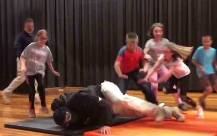  Children as young as ten are taught to pile on top of a gunman