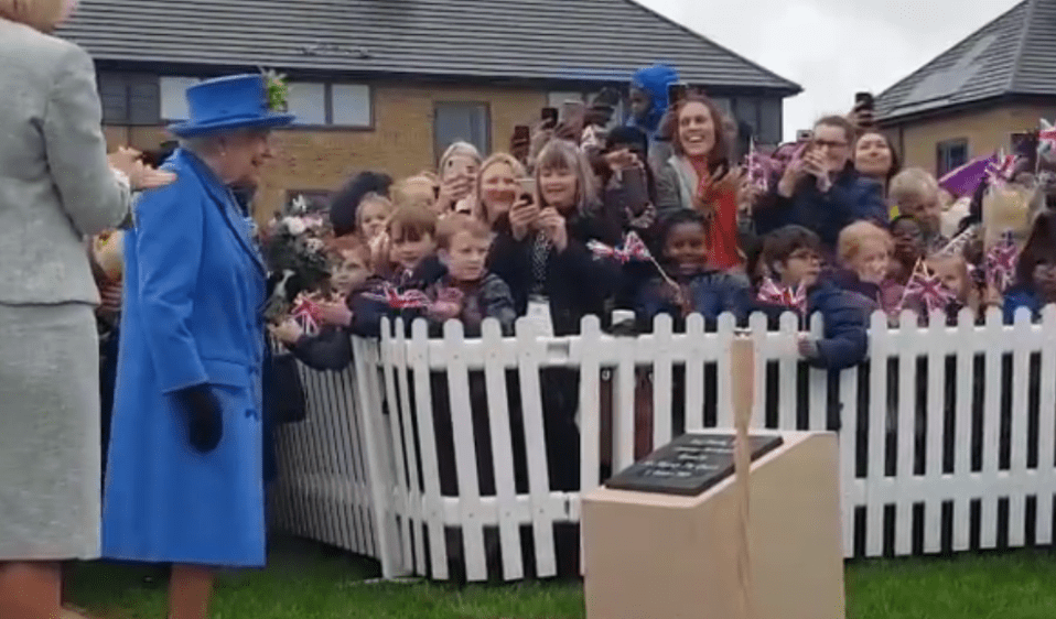  The Queen chuckles as she is praised while unveiling a plaque