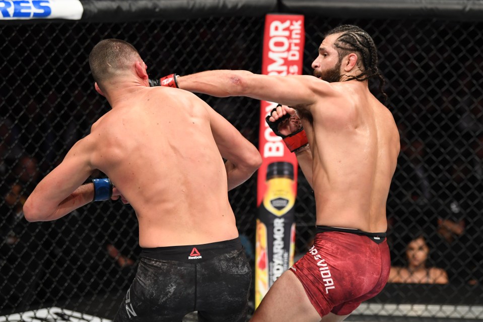  Masvidal punches Nate Diaz in their welterweight bout for the BMF title during the UFC 244 event at Madison Square Garden