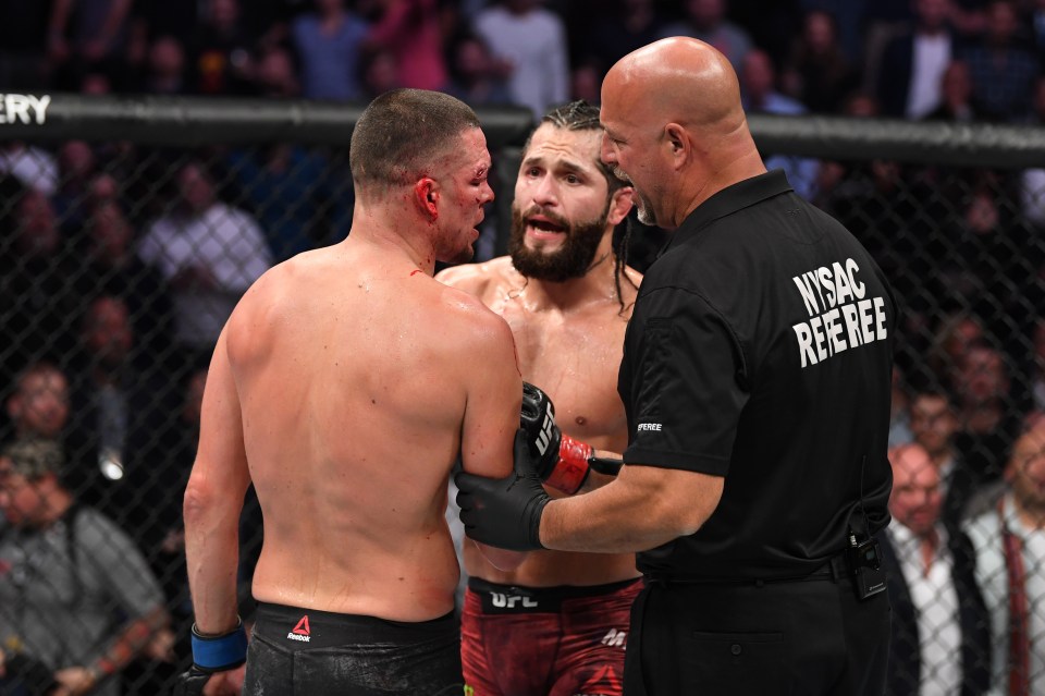  Masvidal and Diaz interact after the doctor's stoppage in their welterweight bout for the BMF title during the UFC 244 event