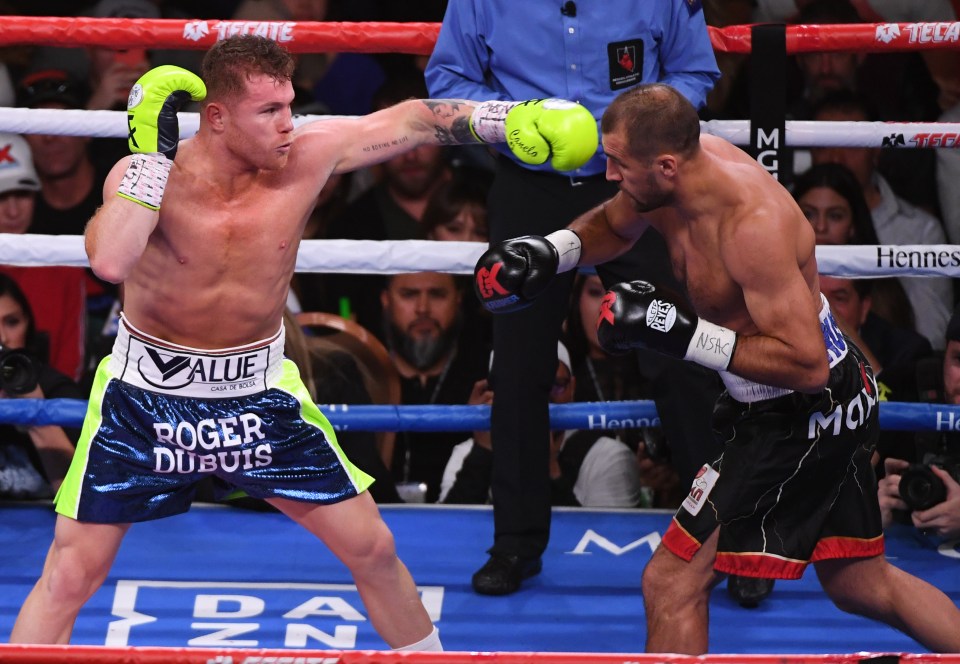  Canelo Alvarez throws a left at Sergey Kovalev during their WBO light heavyweight title fight