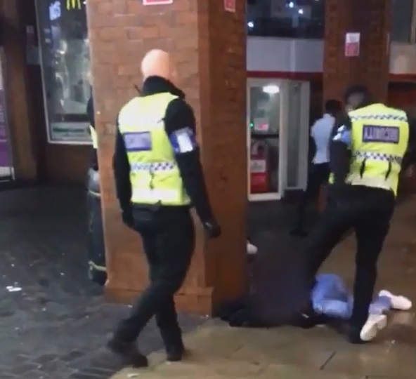  Shocking mobile phone footage shows the moment a security guard kicked the man in the face