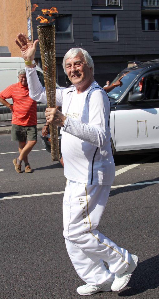  The Sun's Colin Hart carries the Olympic torch in 2012