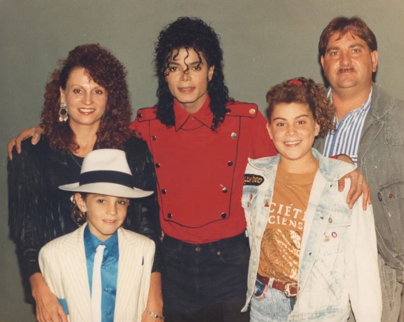 Wade Robson, bottom left, is seen with his family and Michael Jackson