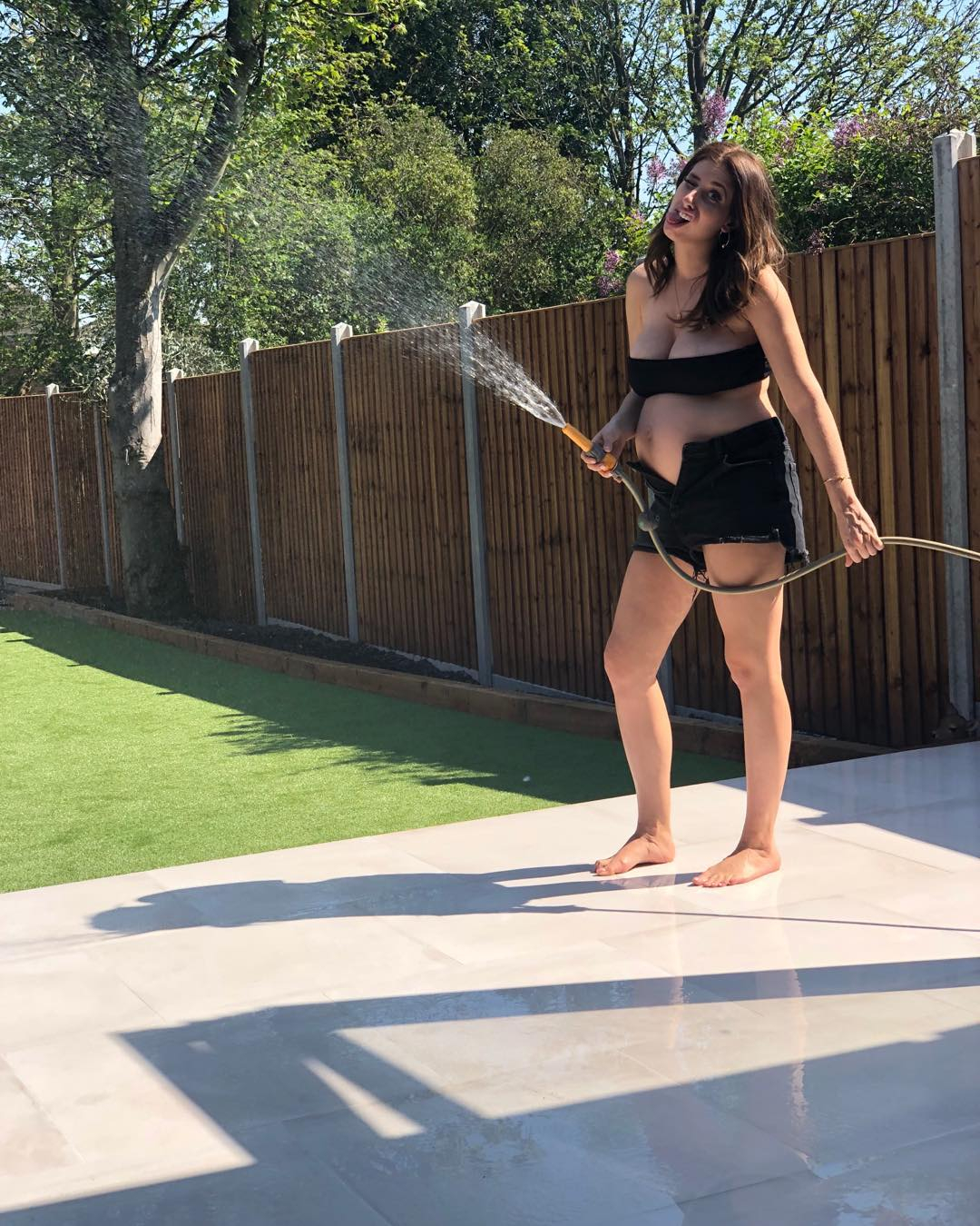 A pregnancy Stacey shared a photo with a hose outside in their spacious garden, which looks perfect for the boys to play in