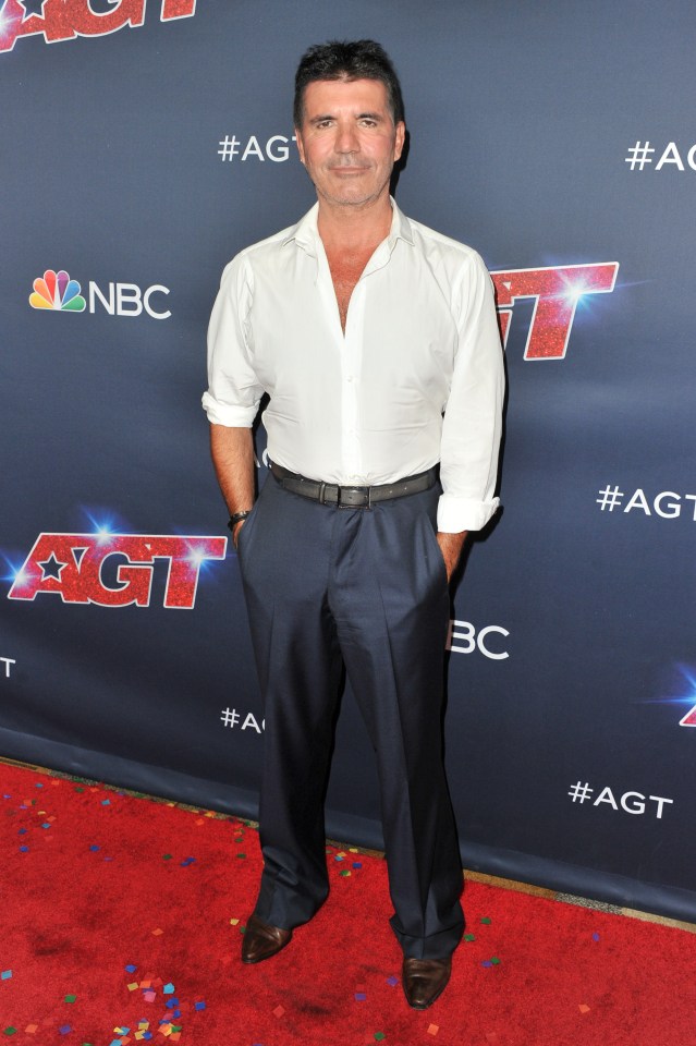  Simon is often seen in a buttoned down shirt