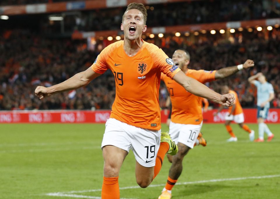  Holland celebrate their dramatic comeback against NI in Rotterdam